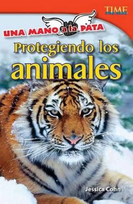 Una mano a la pata: Protegiendo los animales (Hand to Paw: Protecting Animals) (Spanish Version) book