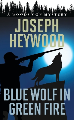 Blue Wolf in Green Fire: A Woods Cop Mystery book